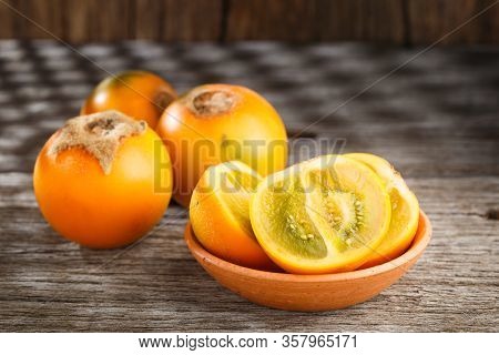 Fruit Of Lulo Or Naranjilla On Wood