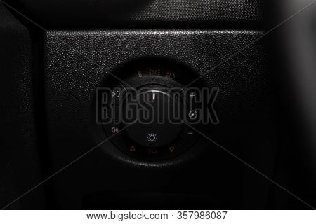 Opel Corsa -close-up On The Headlight Switch Control Buttons,  Automatic Adjust Level Dashboard .nov