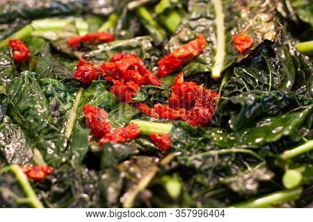 Roasted Black Cabbage With Cherry Tomatoes And Chilli.