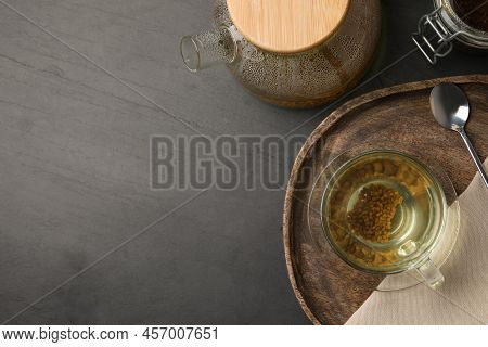 Freshly Made Buckwheat Tea Served On Grey Table, Flat Lay. Space For Text