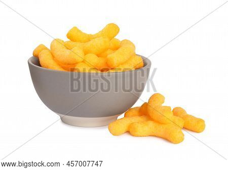 Many Tasty Cheesy Corn Puffs In Bowl Isolated On White