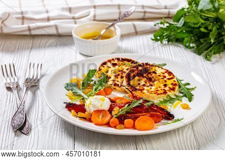 Grilled Baby Carrot Salad With Sherry Vinaigrette, Pickled Raisins, Parisienne Carrots, Rucola And G