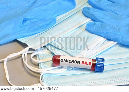 Blood Tube For Test Detection Of Virus Covid-19 Omicron Ba.5 Variant On Protection Masks And Blue Gl