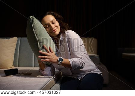 Beautiful Multi Ethnic Woman With Her Closed Eyes Gently Hugs A Velour Soft Pillow Gently Leaning Ag