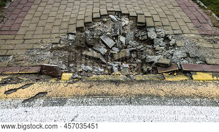 Bucha, Ukraine - June 20, 2022: Crater Funnel From A Snard Explosion At A Crosswalk, Sidewalk, Aspha