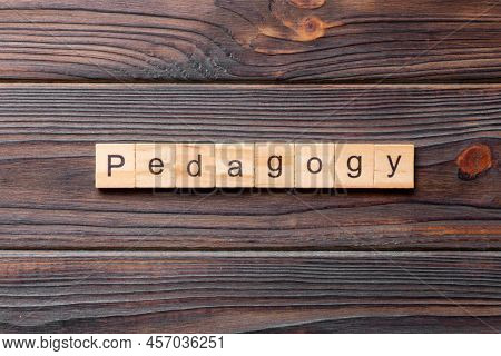 Pedagogy Word Written On Wood Block. Pedagogy Text On Cement Table For Your Desing, Concept.