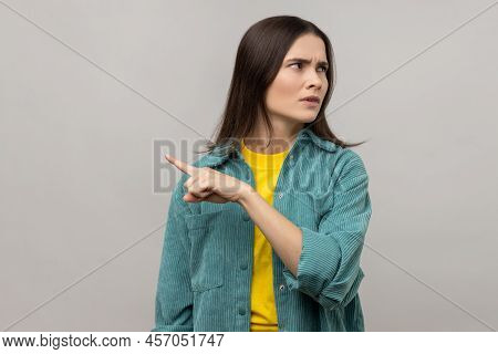 Get Out. Portrait Of Upset Vexed Woman With Dark Hair Showing Exit, Demanding To Leave Her Alone, Tu