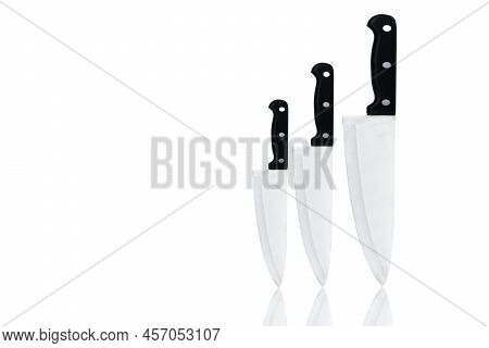 Set Of New Sharp Chef Knives With Black Handle Isolated On White Background. Stainless Steel Knife F
