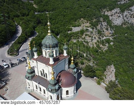 Aerial View Of Foros Church And Mount Road Through The Spring Forest. Popular Tourist Attraction Nea