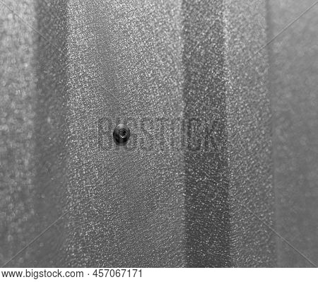 Close-up Of A Rivet In A Profiled Sheet. The Method Of Fastening The Profiled Sheet.
