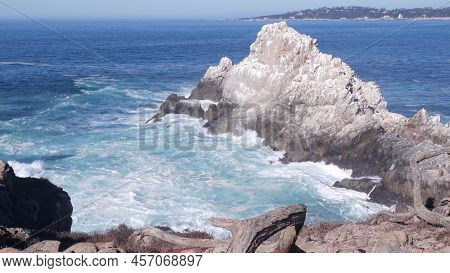 Rocky Craggy Ocean Beach. Big Waves Crashing On Bare Cliff, Blue Water Splashing, Sea Foam. Power Of