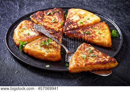 Close-up Of Potato Farls, Irish Potato Cakes, Potato Bread On Black Plate On Concrete Table, Horizon