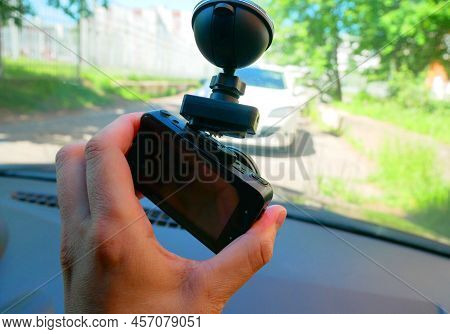 Installing The Dvr In The Car. Dvr On The Windshield Of The Car.