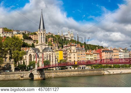 Pedestrian Saint Georges Footbridge And The Saint Georges Church In Lyon, France In A Beautiful Summ