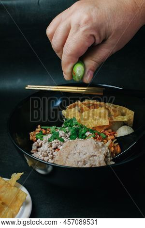 Spicy Tomyum Thai Noodle Soup With Lemon, Chilis,coriander, Lemon Grass. Thai Noodle Street Food.