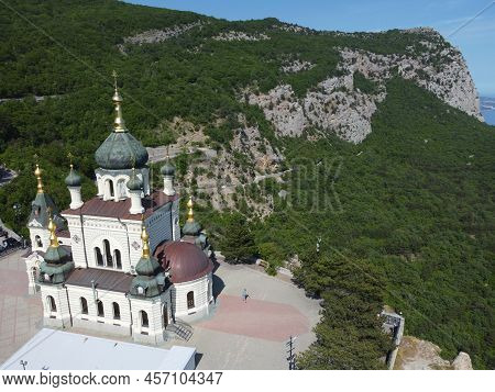 Aerial View Of Foros Church And Mount Road Through The Spring Forest. Popular Tourist Attraction Nea