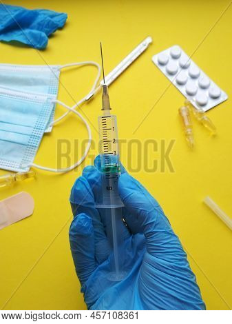 Syringe For Injections In The Hand Of A Doctor, Background Image
