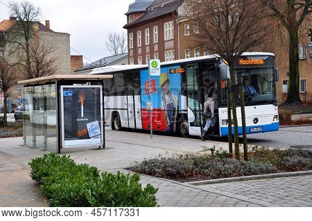 Guben, Germany - January 5, 2013: Motorbus At Public Transport Bus Stop On City Street Road.