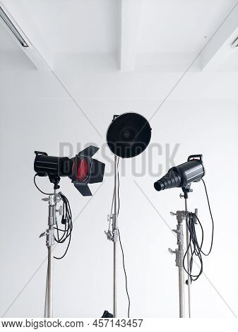 Professional Lighting Equipment, Flashes, C-stands On A Cyclorama In Modern Photo Studio. Octabox, S