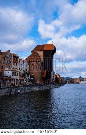 Ancient Crane - Zuraw Old Town In Gdansk. The Riverside On Granary Island Reflection In Moltawa Rive