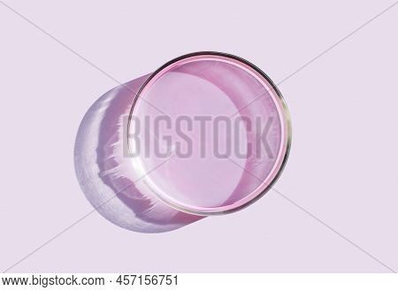 Petri Bowl With Liquid On A Plain Pink Background Petri Dish With Cosmetic Samples
