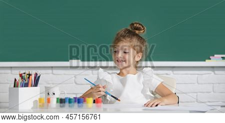 Child Girl Drawing With Coloring Pens Paintind. Portrait Of Adorable Little Girl Smiling Happily Whi