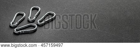 4mm Climbing Carabiner Isolated Against A Dark Background