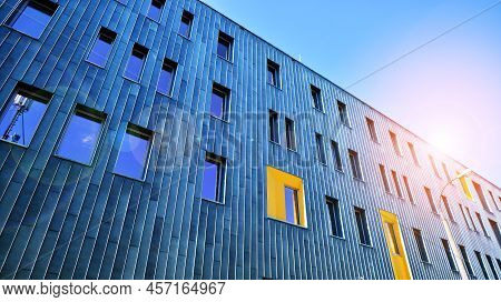 Fragment Of Modern Urban Geometry. Walls  Office Building Made Of Steel And Glass. Bright Sunny Day 