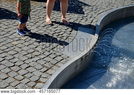 On The Square There Are Spray Nozzles In A Regular Grid Which Spray Upwards According To The Program