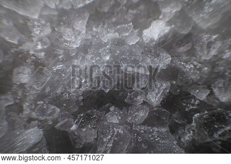 Close-up Of Crystals Of Dark Sea Iodized Salt. Extreme Macro Background Minerals Salt