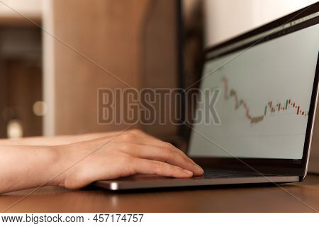 Female Hands Typing Numbers On Laptop. Investment Analysis, Trading Concept. Technology, Digitalizat