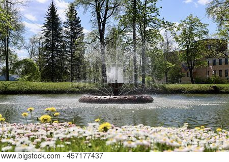 Fountain Splashing Water In Basin From Rotating Sprays, Aluksne Town, Latvia