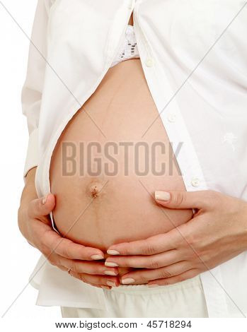 임신 흰 배경에 고립 된 배를 잡고