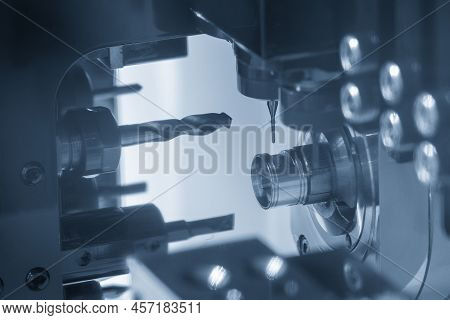 The Multi-tasking Cnc Lathe Machine Swiss Type Hole Drilling On The Metal Parts. The High Technology