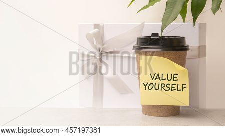 A Handwritten Note On A Disposable Coffee Cup. Value Yourself