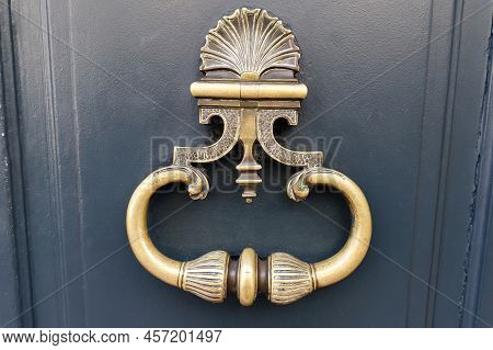 European Vintage Old Metal Wrought Iron Door Knocker. Design Detail. Paris.