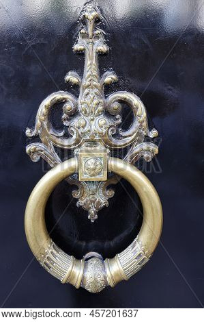European Vintage Old Metal Wrought Iron Door Knocker. Design Detail. Paris.