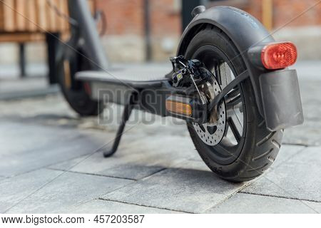 Close Up Electric Scooter On The Road In City