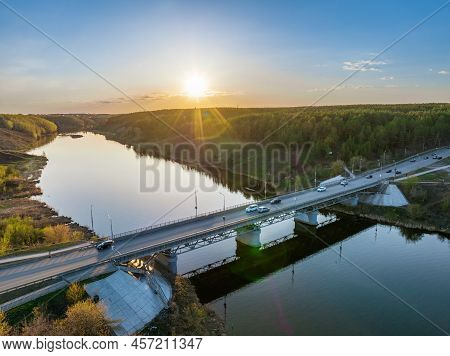 Beautiful View Of The Bridge Across The Iset River In The City Of Kamensk-uralsky At Sunset In Sprin
