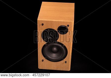 Single Home High Fidelity Two-way Loudspeaker System With Bass Reflex Port In Wooden Housing On A Bl