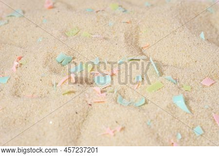 Conceptual Composition Of Microplastics And Coastal Sand. The Concept Of Environmental Damage. The I