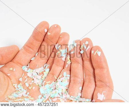 A Close-up Photo Of Microplastics Lay On Human Hand. The Idea Of Environmental Damage. Concept Of Wa
