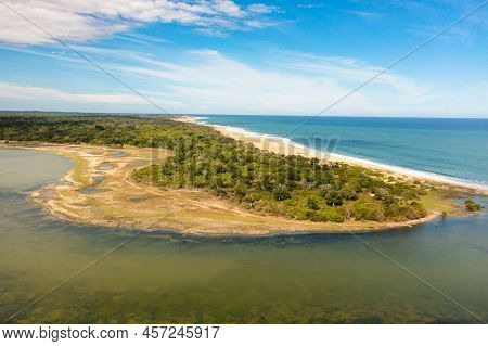 Ocean With A Beach In The National Park Among The Jungle.