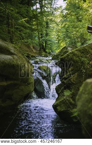 Small Wtaerfall In The Nature Area Mullerthal In Luxemburg