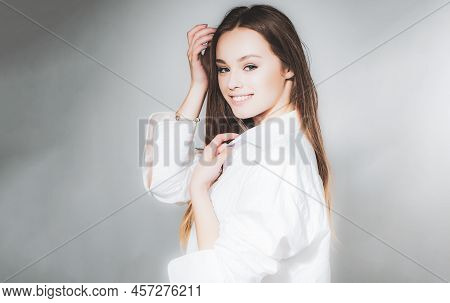 Young Beautiful Cute Cheerful Girl Smiling Looking At Camera Over Grey Background. Attractive Beauty