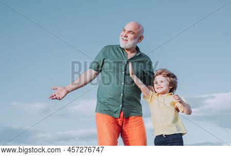 Two Generation - Weekend Together. Two Different Generations Ages: Grandfather And Grandson Together