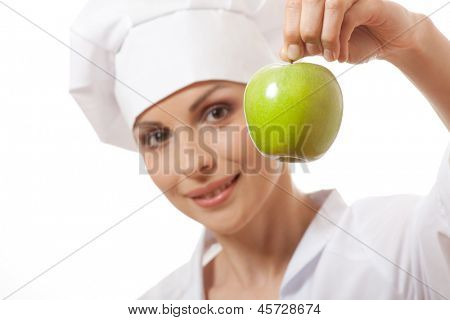 Smilende kvinde cook med apple, isoladed på hvid baggrund