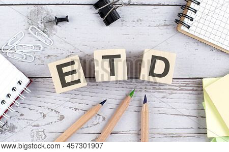 Etd Text On Wooden Block With Office Tools On Wooden Background