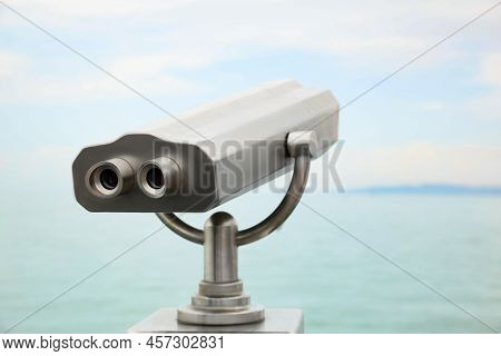 Metal Tower Viewer Installed Near Sea. Mounted Binoculars