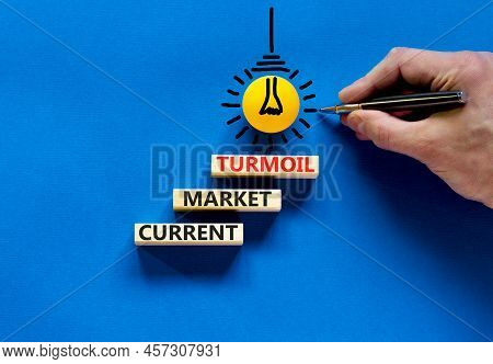 Current Market Turmoil Symbol. Concept Words Current Market Turmoil On Wooden Blocks On A Beautiful 